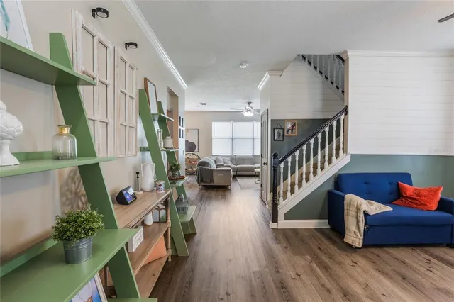 a view of entryway livingroom and hall with wooden floor