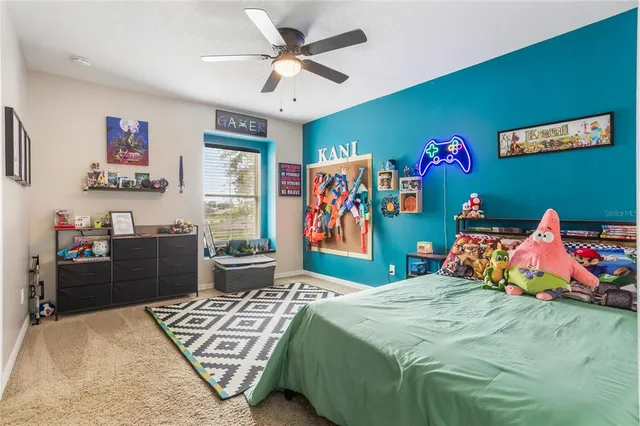 a bedroom with a bed and cabinets