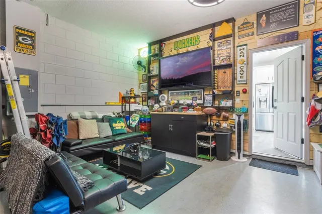 a room with furniture and a flat screen tv