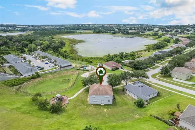 a view of a lake with a house in the background