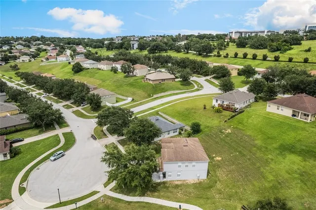 an aerial view of a house with a garden