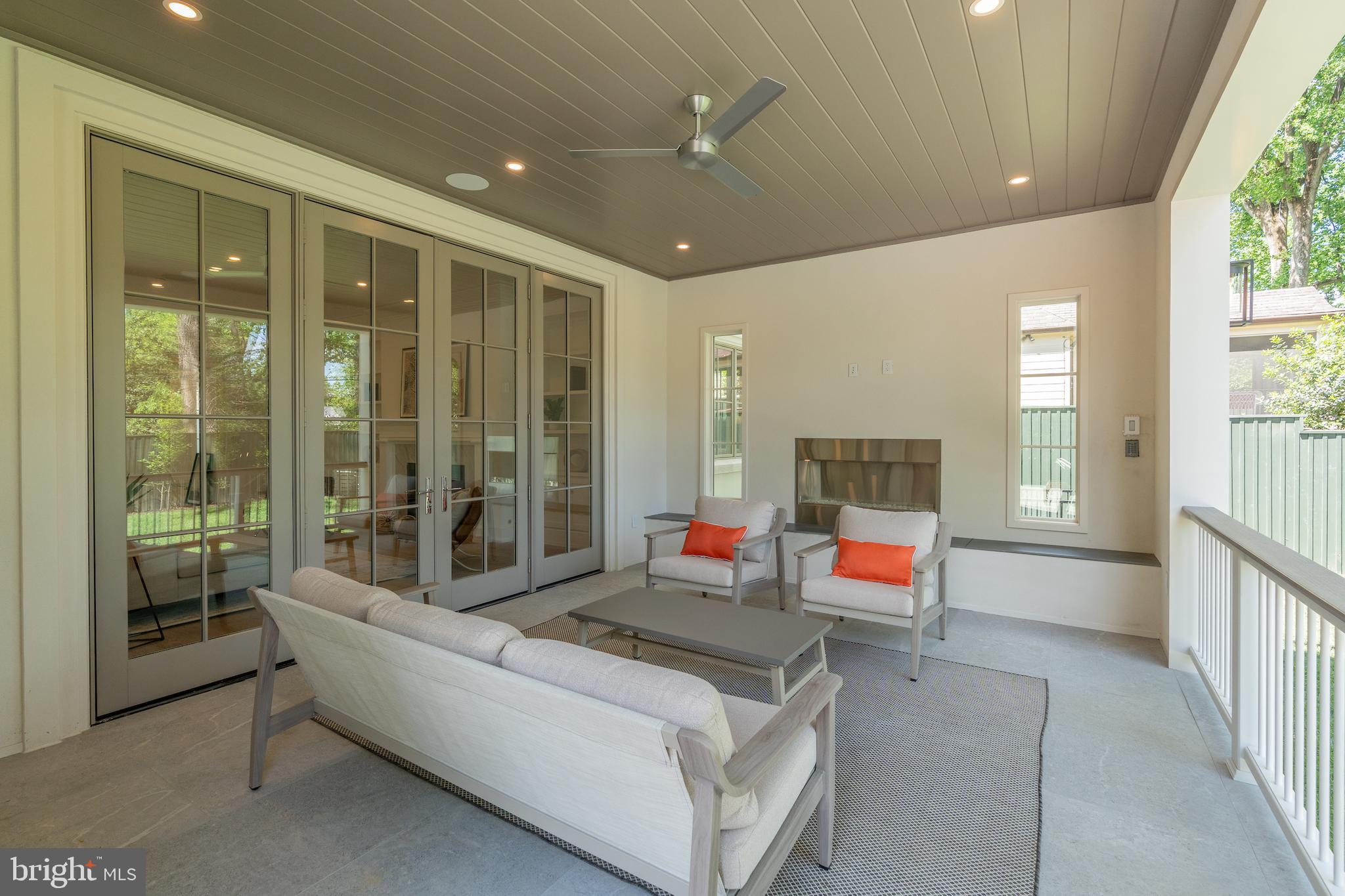 4821 Rodman Street Northwest Washington, DC 20016 - Photo 26 of 52 a living room with furniture and a fireplace