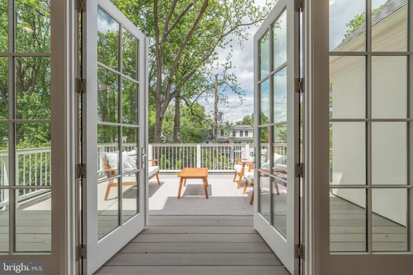 a view of balcony with furniture