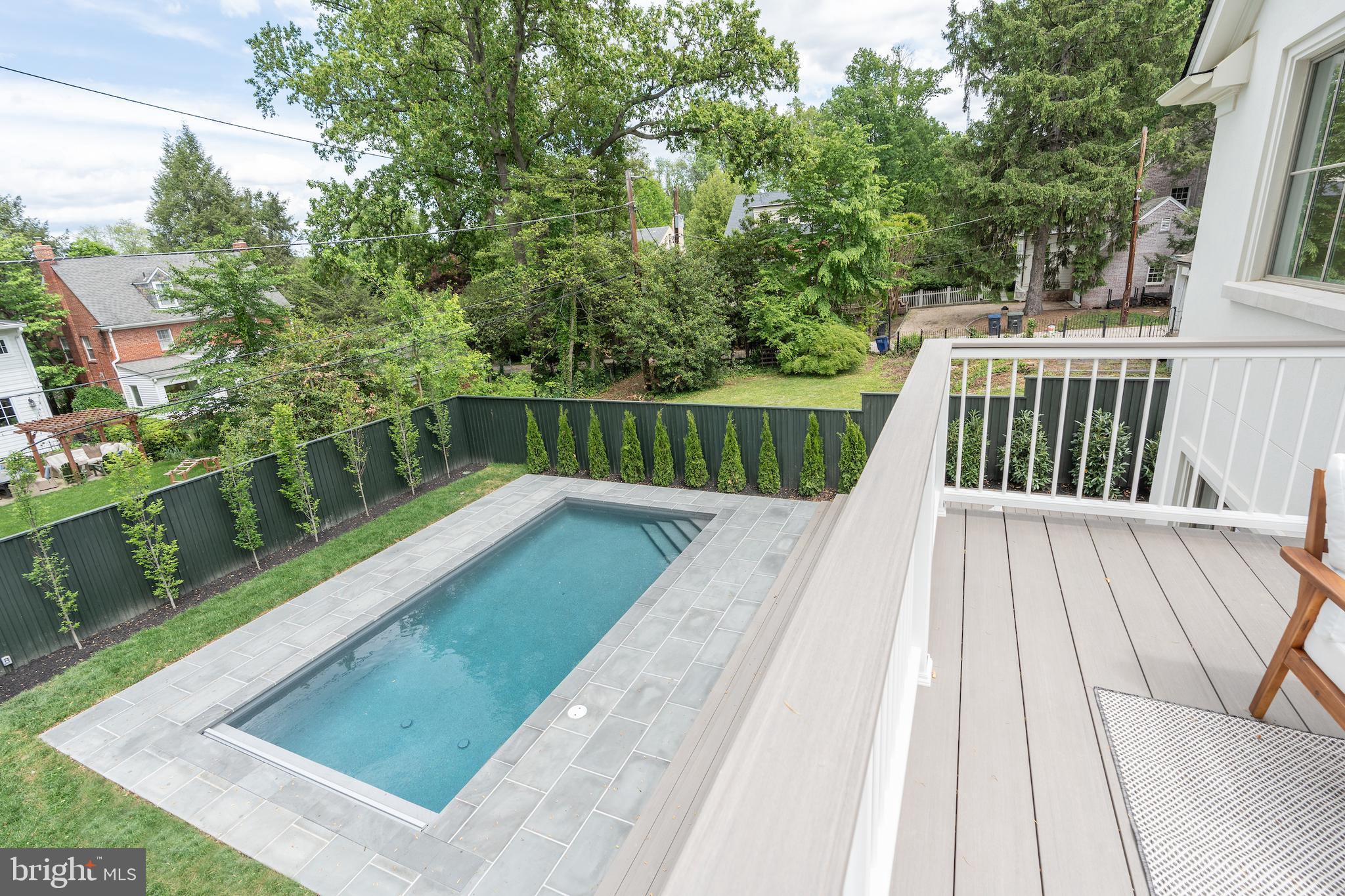 4821 Rodman Street Northwest Washington, DC 20016 - Photo 34 of 52 a view of balcony with wooden floor and fence