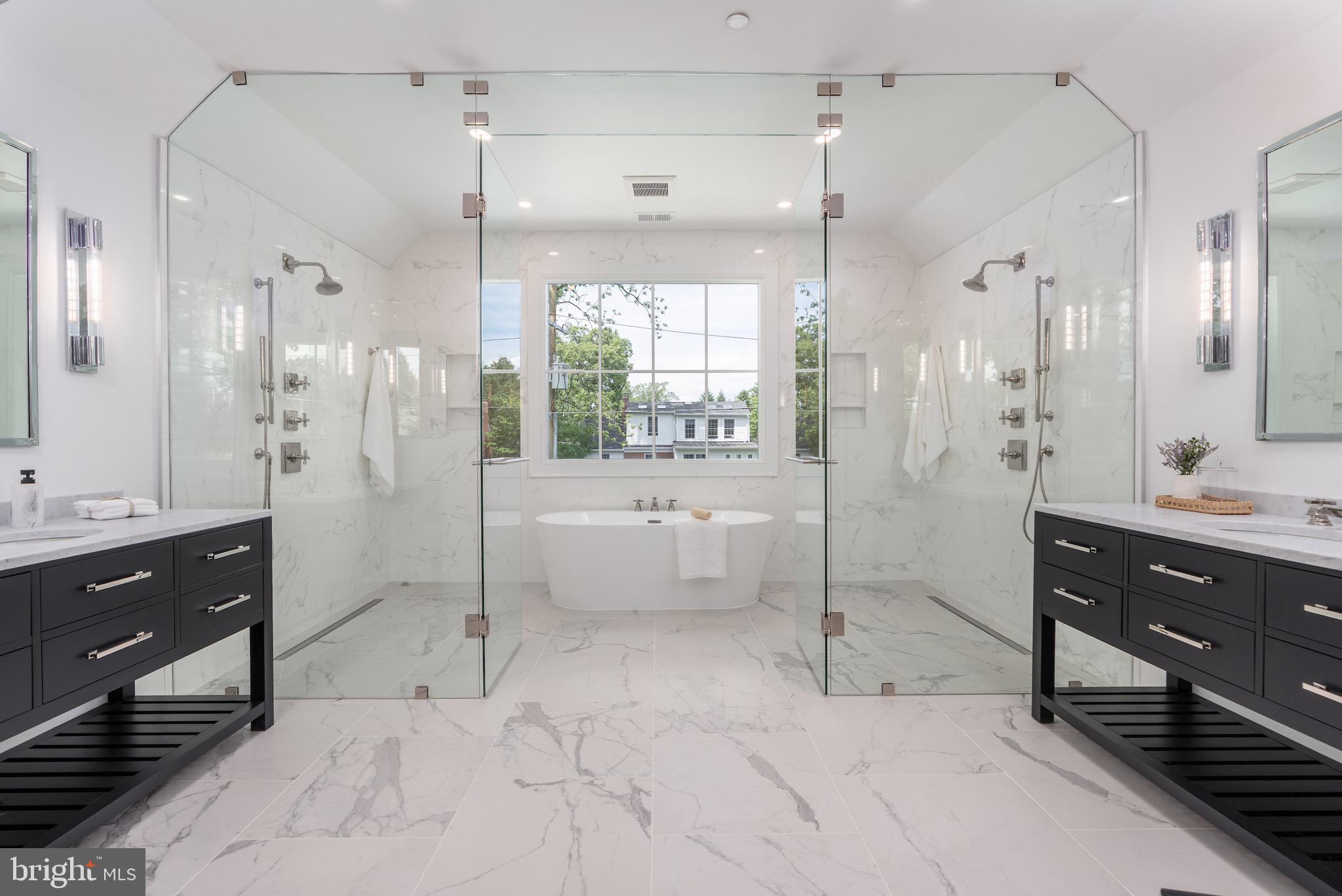 4821 Rodman Street Northwest Washington, DC 20016 - Photo 36 of 52 a bathroom with a double vanity sink toilet and shower