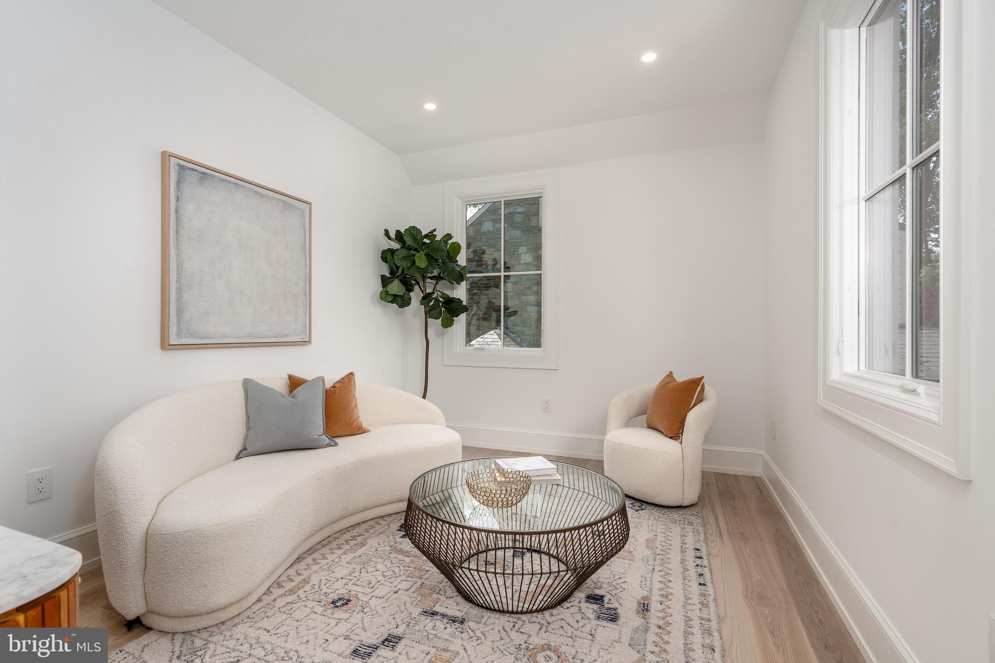 4821 Rodman Street Northwest Washington, DC 20016 - Photo 39 of 52 a living room with furniture and a wooden floor