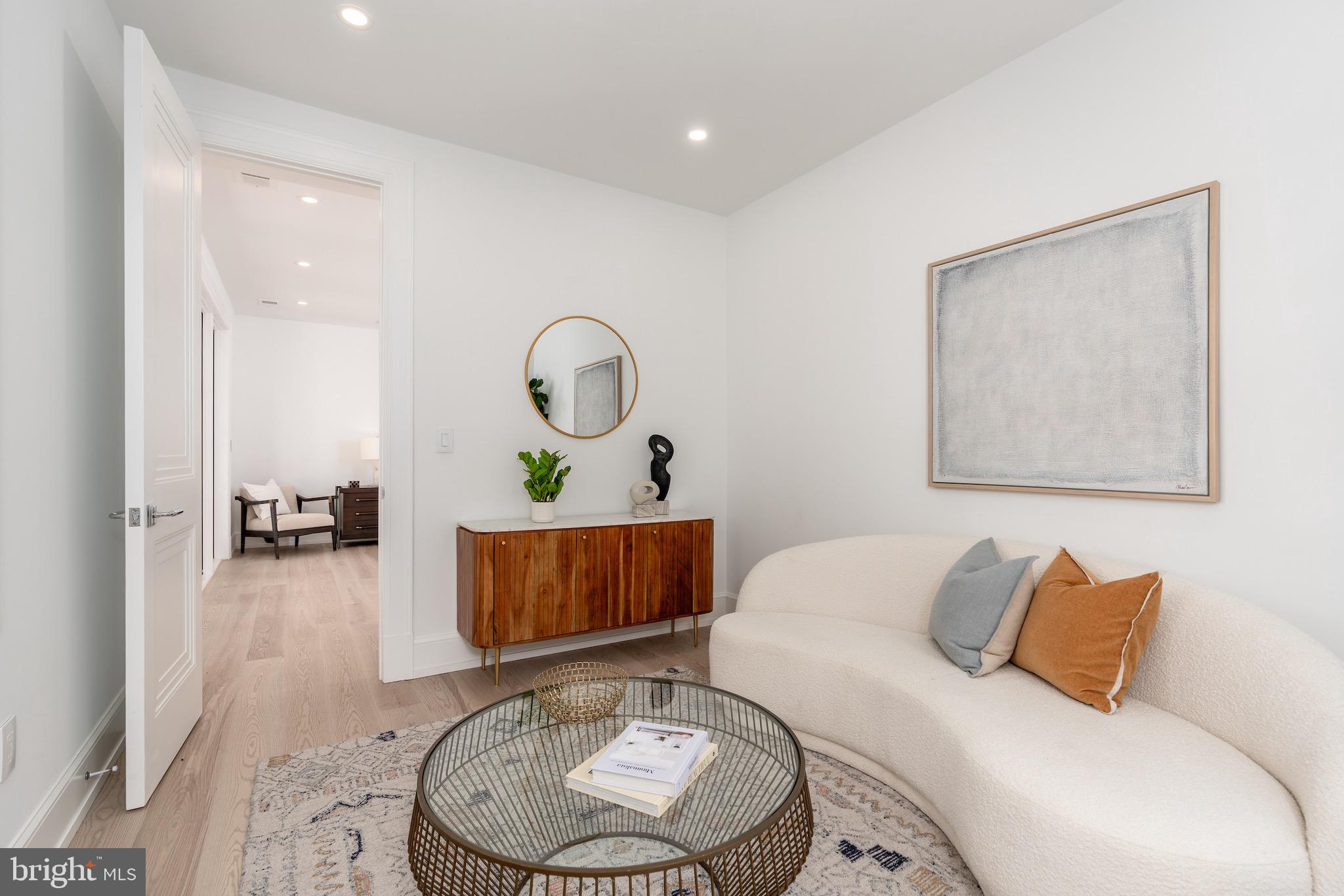 4821 Rodman Street Northwest Washington, DC 20016 - Photo 40 of 52 a living room with furniture and a wooden floor