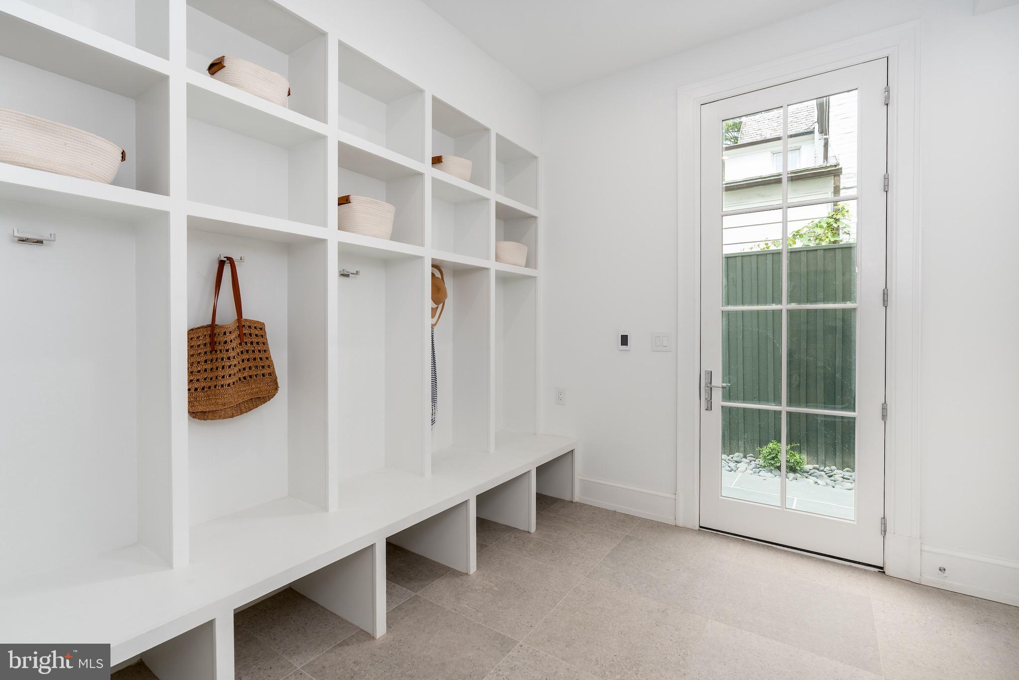 4821 Rodman Street Northwest Washington, DC 20016 - Photo 47 of 52 a view of walk in closet with empty racks