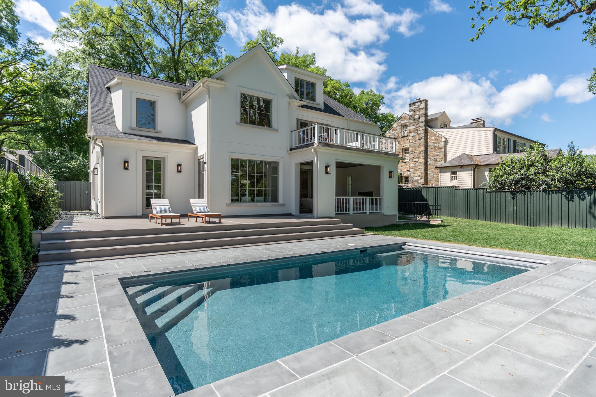 4821 Rodman Street Northwest Washington, DC 20016 - Photo 48 of 52 a view of a house with a swimming pool