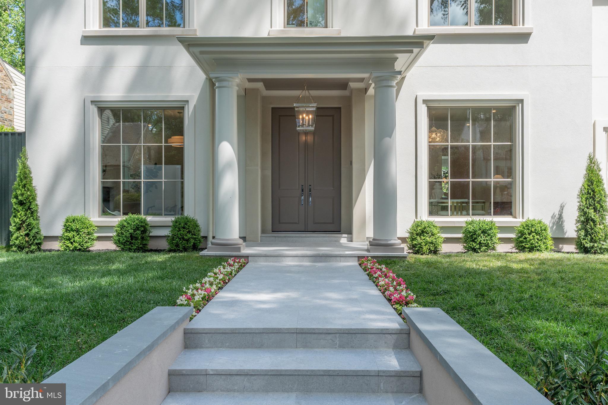 4821 Rodman Street Northwest Washington, DC 20016 - Photo 5 of 52 a front view of a house with garden
