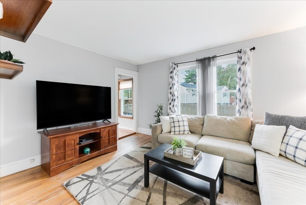 34 Julian Road Randolph, MA 02368 - Photo 12 of 19 a living room with furniture and a flat screen tv