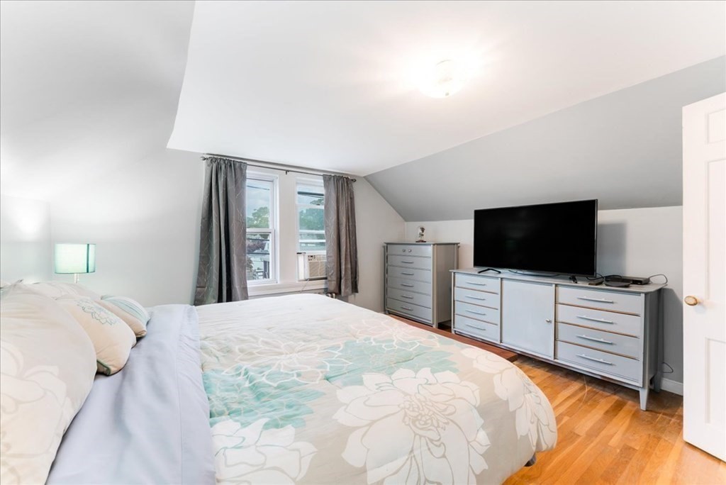 34 Julian Road Randolph, MA 02368 - Photo 16 of 19 a bedroom with a bed and a flat screen tv
