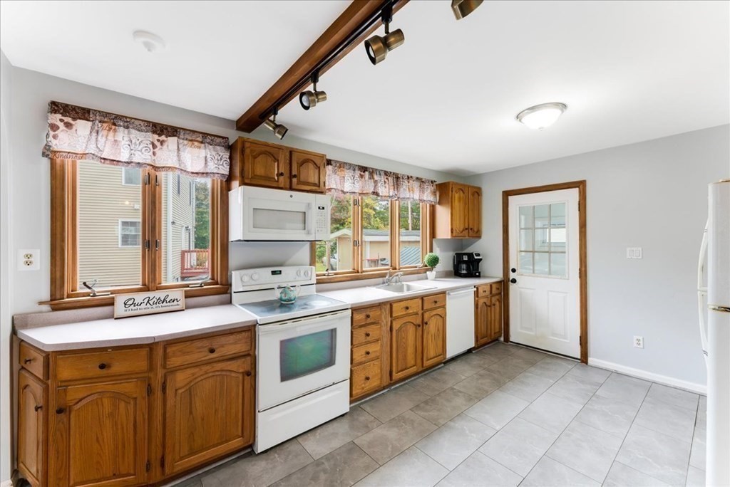34 Julian Road Randolph, MA 02368 - Photo 5 of 19 a large white kitchen with a stove top oven
