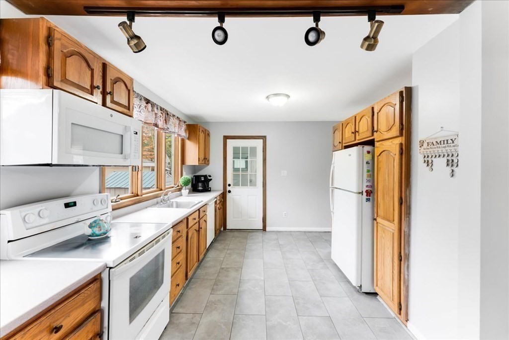 34 Julian Road Randolph, MA 02368 - Photo 6 of 19 a kitchen with stainless steel appliances a refrigerator and a sink