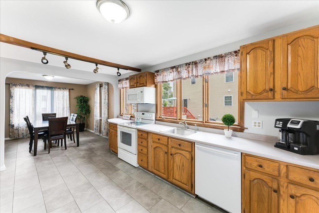 34 Julian Road Randolph, MA 02368 - Photo 7 of 19 a large white kitchen with a large window