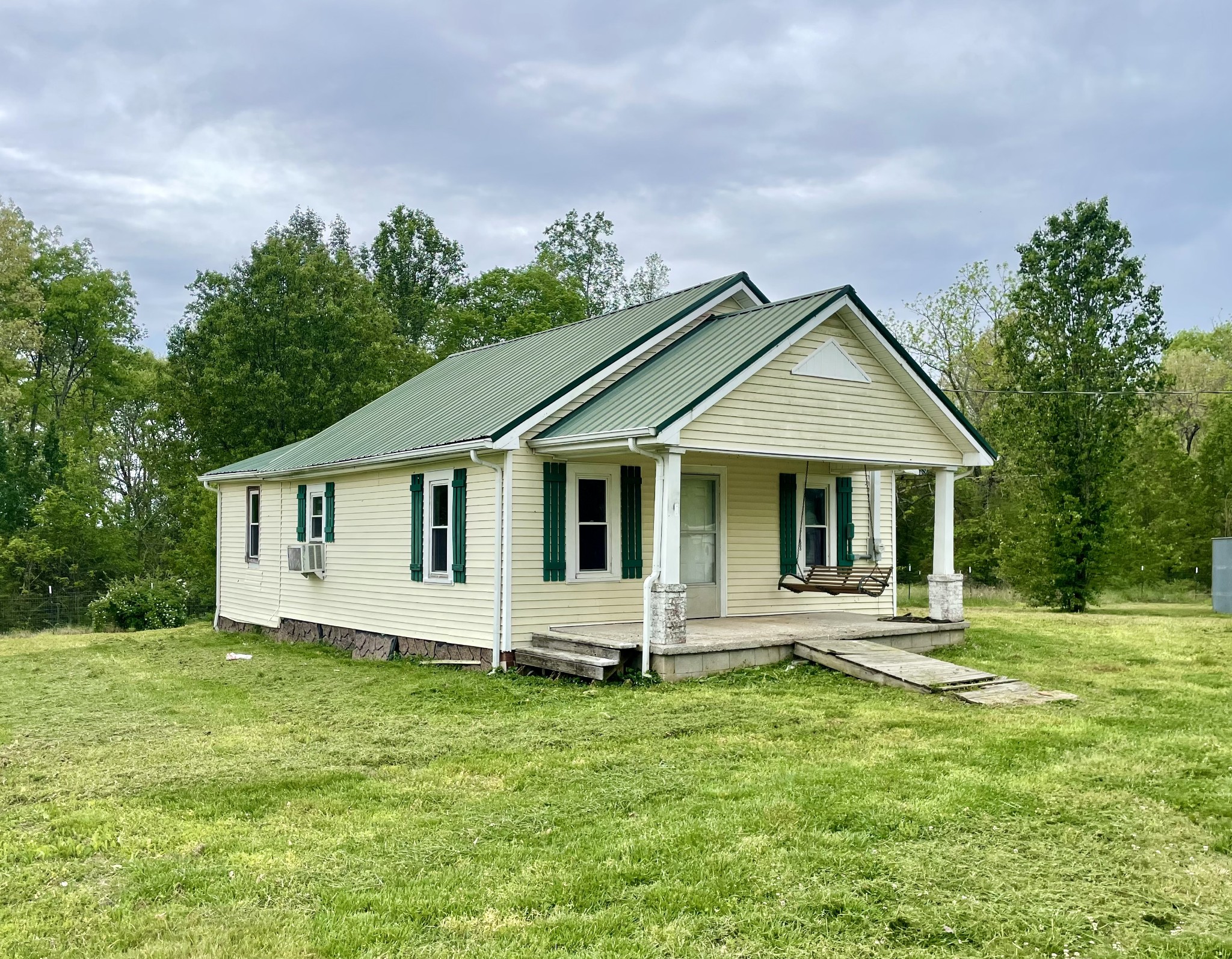 110 Shannon Road Leoma, TN 38468 - Photo 1 of 9 a front view of a house with a yard