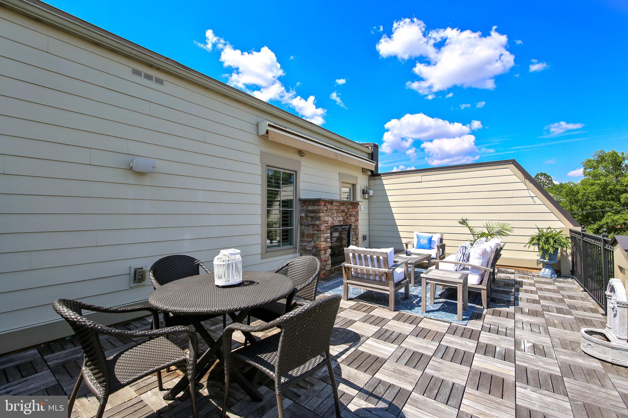 1411 Ridgeview Way Washington, DC 20007 - Photo 30 of 43 a backyard of a house with table and chairs