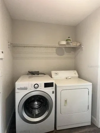 a utility room with dryer and washer