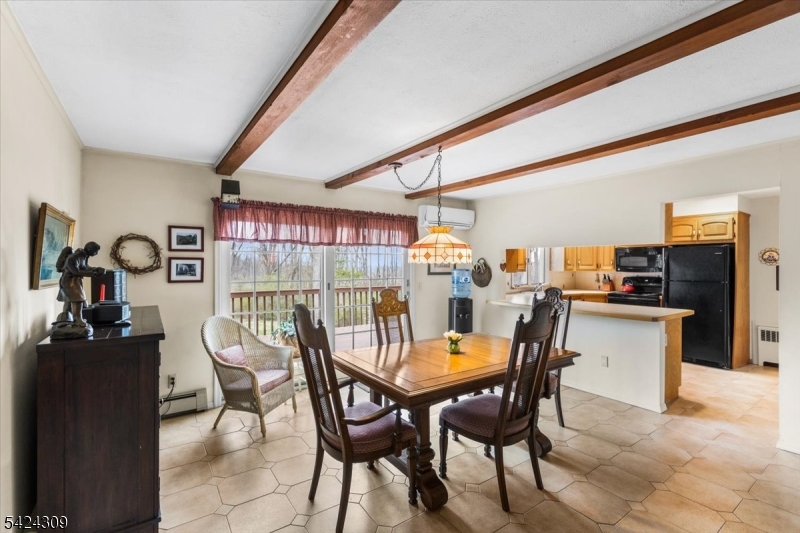 58 Andover Road Sparta, NJ 07871 - Photo 14 of 38 a dining room with furniture and window