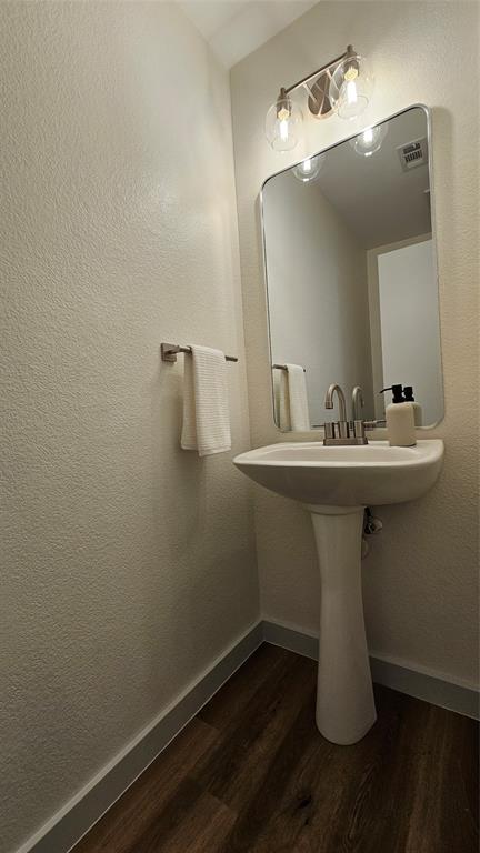 3437 Caprock Ranch Road Fort Worth, TX 76262 - Photo 12 of 27 a bathroom with a sink a mirror and vanity