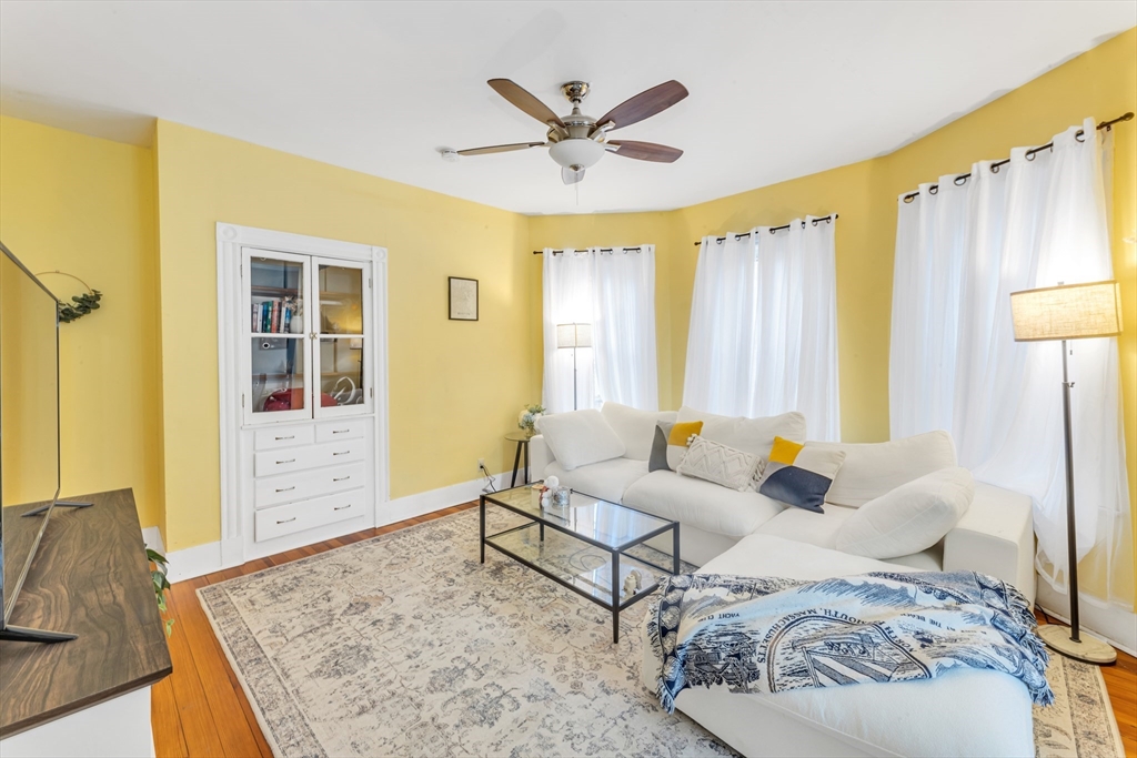 15 Bynner Street, Unit 1 Boston, MA 02130 - Photo 2 of 27 a living room with furniture and a large window