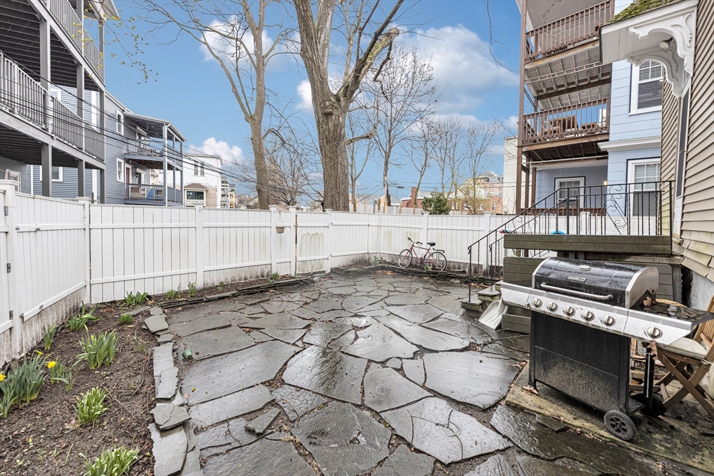 15 Bynner Street, Unit 1 Boston, MA 02130 - Photo 22 of 27 a view of a yard with chairs