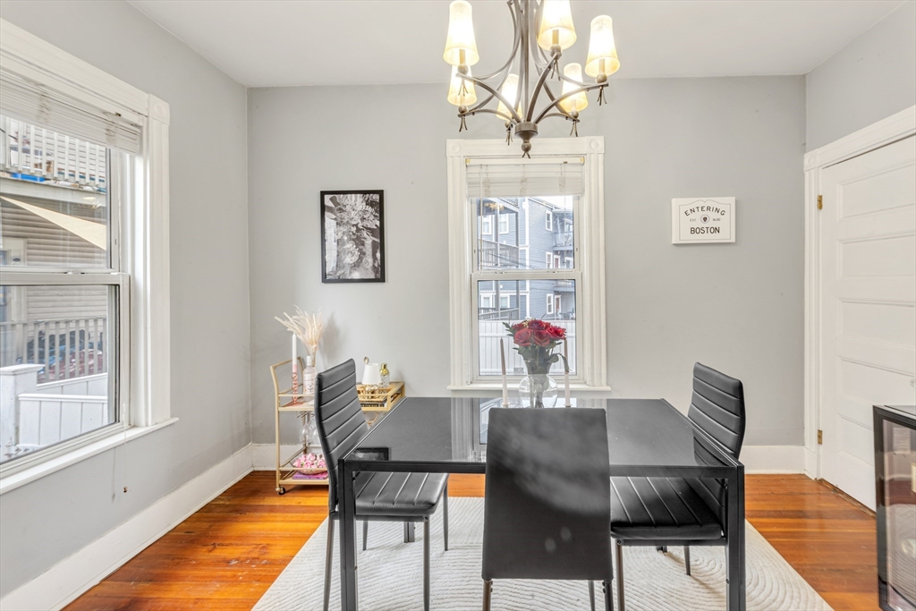 15 Bynner Street, Unit 1 Boston, MA 02130 - Photo 3 of 27 a view of a dining room with furniture and a window