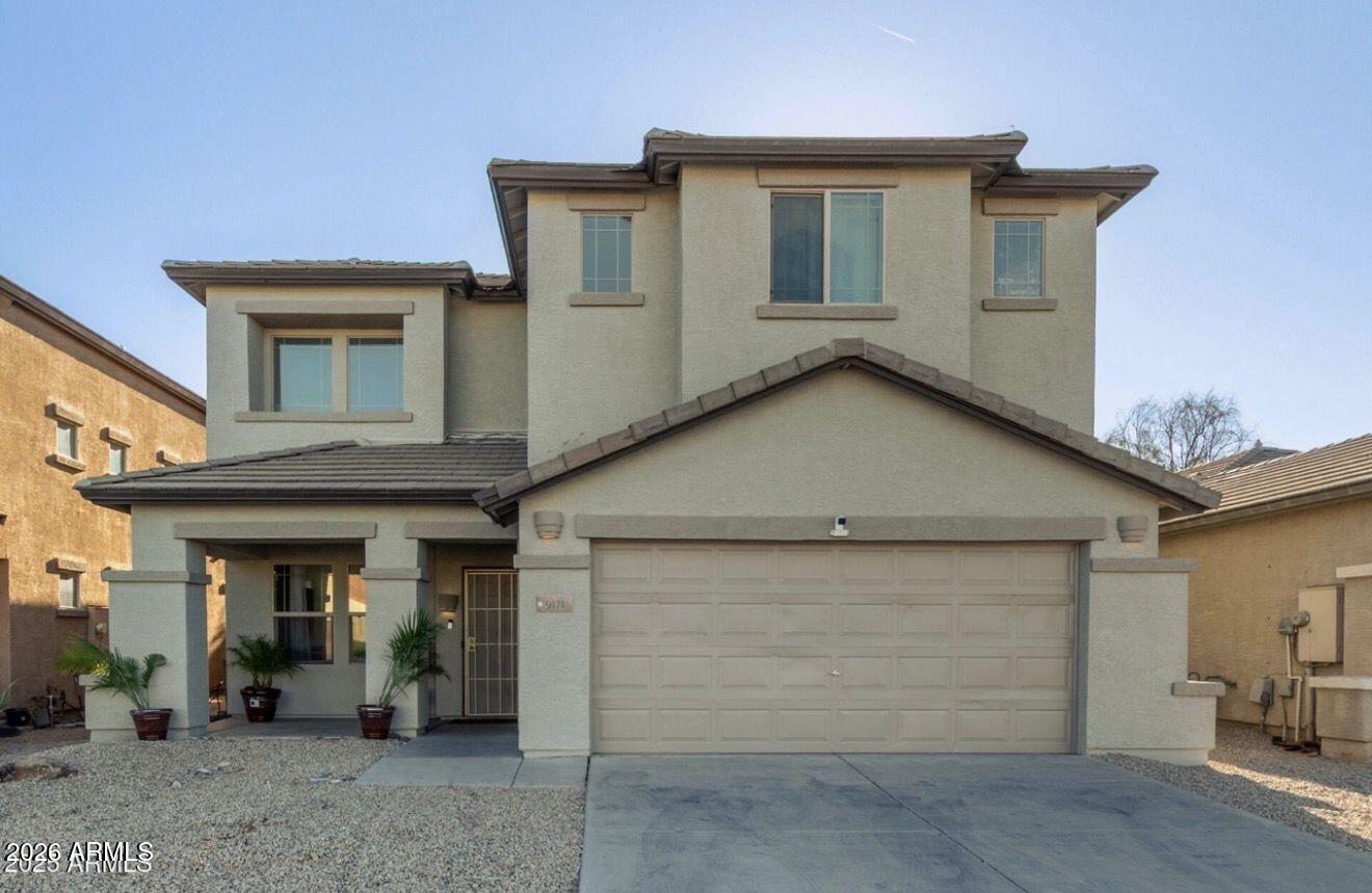 9171 West Berkeley Road Phoenix, AZ 85037 - Photo 2 of 36 a view of a house with garage