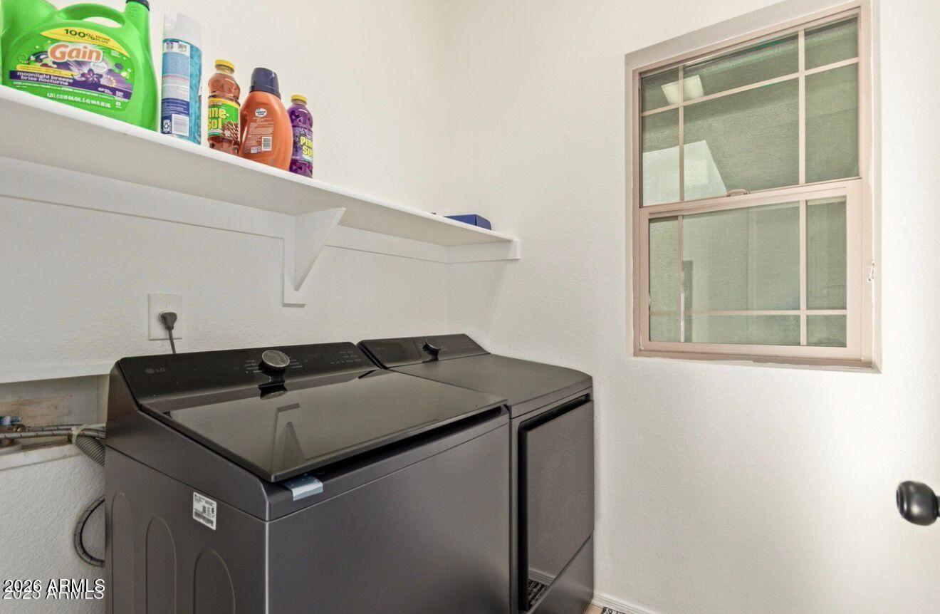 9171 West Berkeley Road Phoenix, AZ 85037 - Photo 24 of 36 a utility room with dryer and washer
