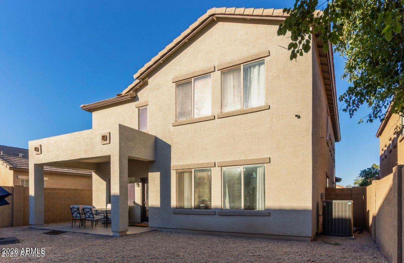 9171 West Berkeley Road Phoenix, AZ 85037 - Photo 33 of 36 a view of a house with a yard