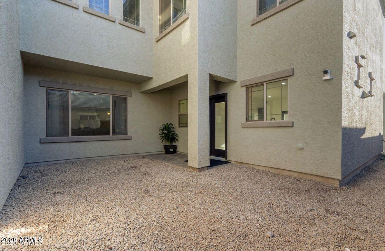 9171 West Berkeley Road Phoenix, AZ 85037 - Photo 34 of 36 an empty room with windows