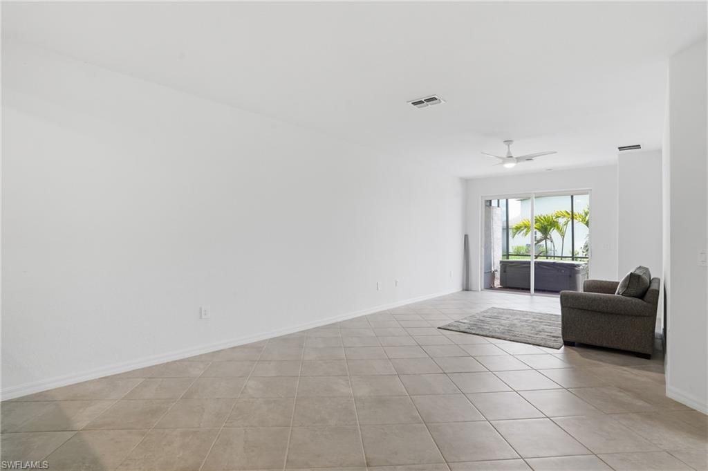 2215 Dragonfruit Way Naples, FL 34120 - Photo 11 of 38 a living room with furniture and window