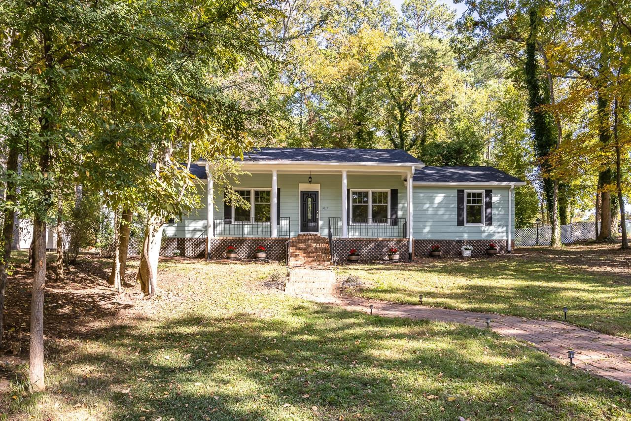 3517 Brecknock Street Durham, NC 27705 - Photo 1 of 38 a view of a house with swimming pool and a big yard