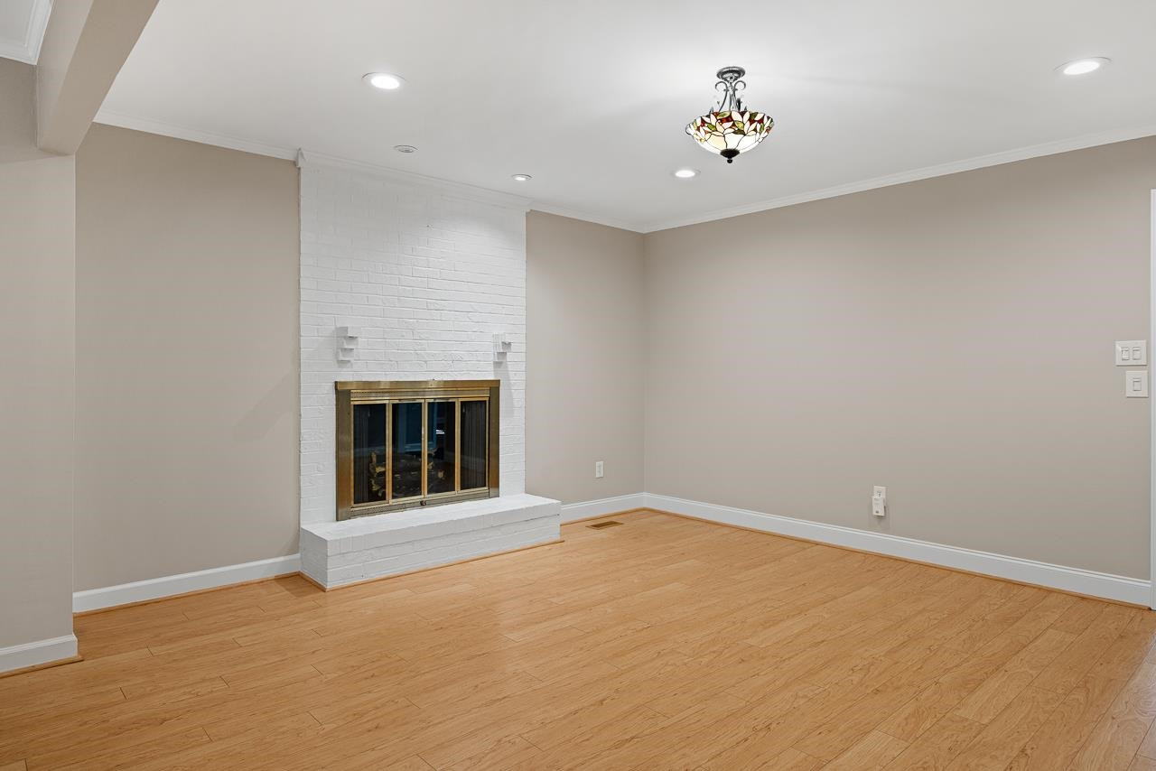 3517 Brecknock Street Durham, NC 27705 - Photo 19 of 38 an empty room with a fireplace