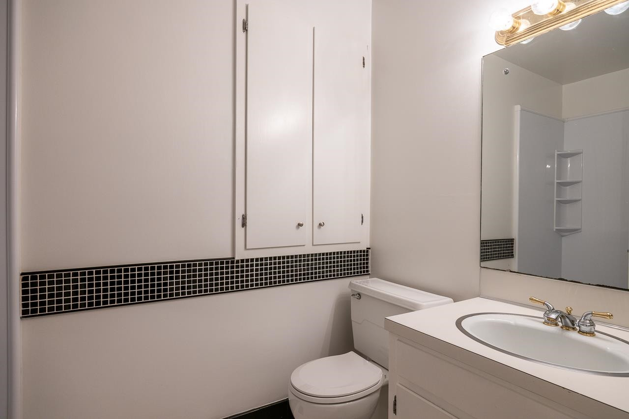 3517 Brecknock Street Durham, NC 27705 - Photo 25 of 38 a bathroom with a sink a toilet and shower