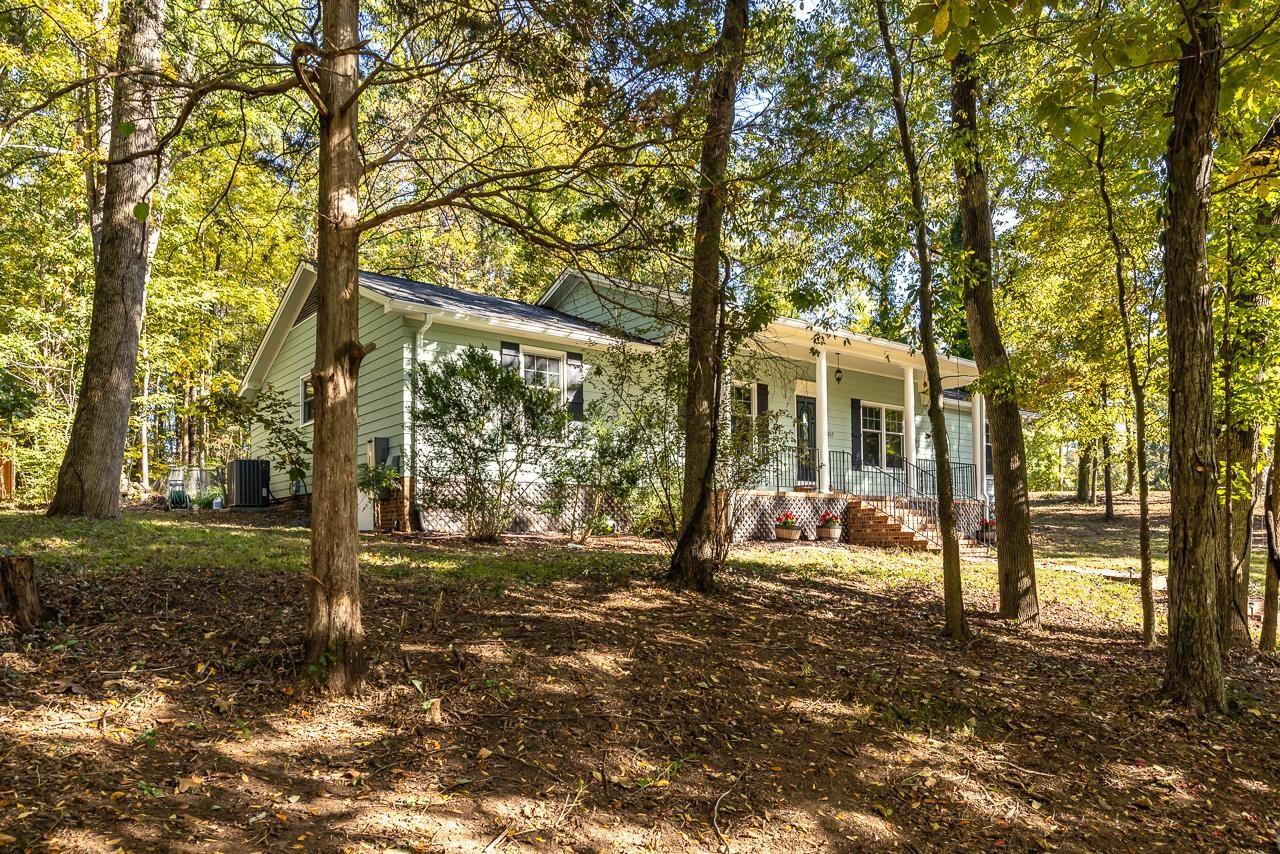 3517 Brecknock Street Durham, NC 27705 - Photo 35 of 38 a view of a house with backyard and trees