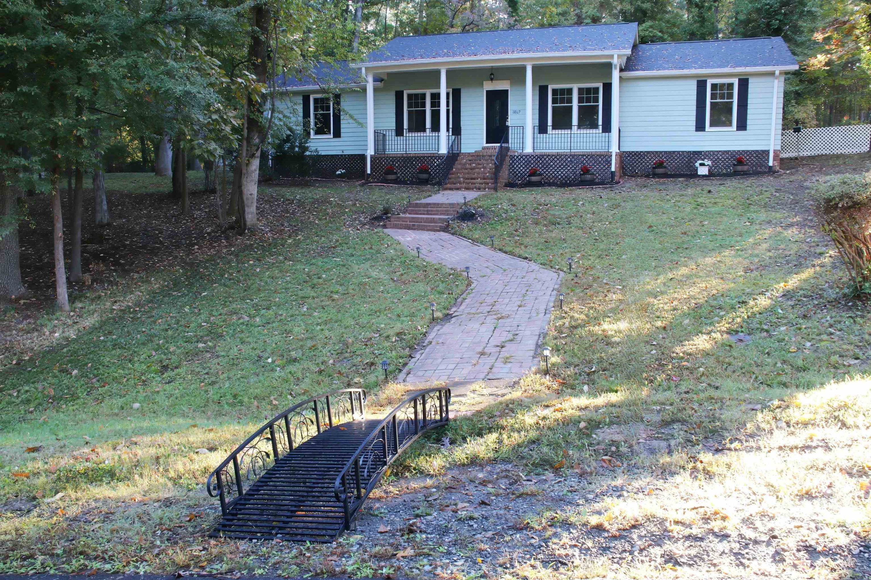 3517 Brecknock Street Durham, NC 27705 - Photo 37 of 38 a view of a house with a yard