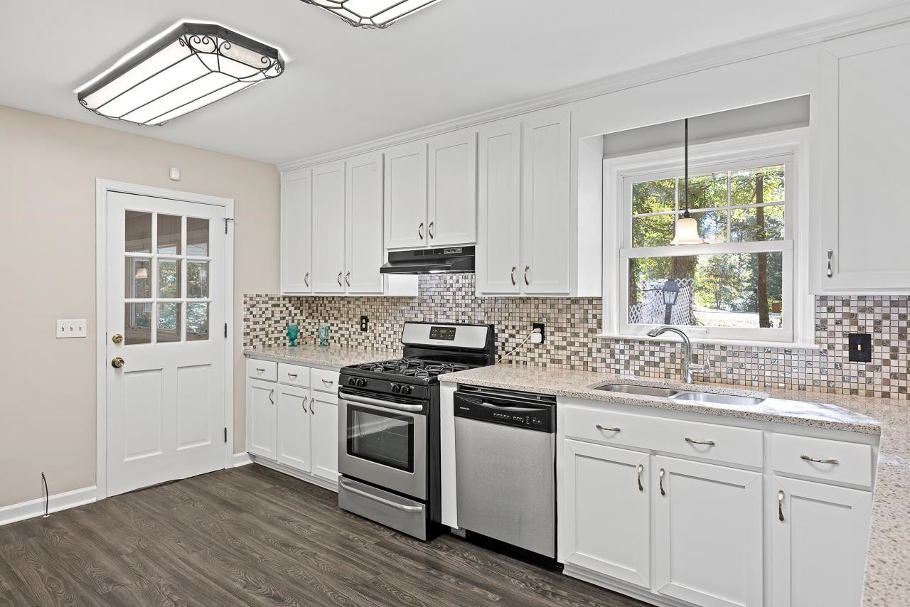 3517 Brecknock Street Durham, NC 27705 - Photo 9 of 38 a kitchen with appliances cabinets and a window