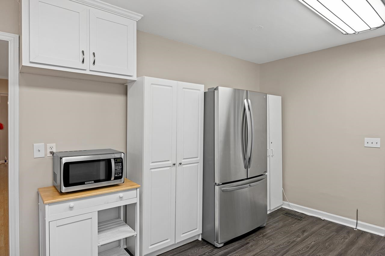 3517 Brecknock Street Durham, NC 27705 - Photo 10 of 38 a kitchen with a refrigerator a microwave and stove