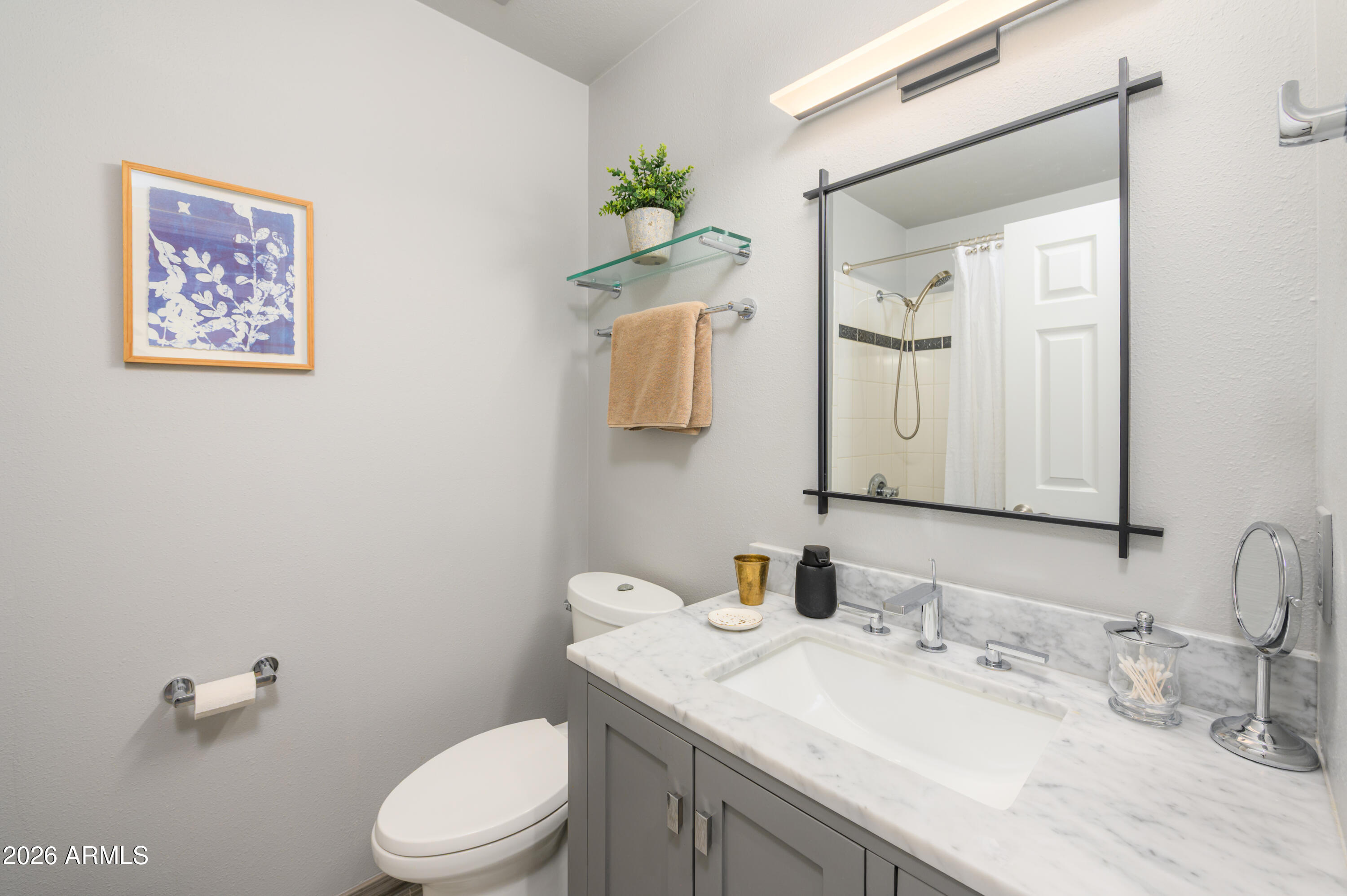 190 Creek Rock Road Sedona, AZ 86351 - Photo 23 of 41 a bathroom with a granite countertop sink mirror and toilet