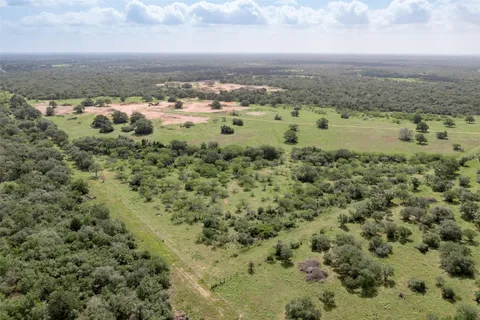 a view of a field with an ocean