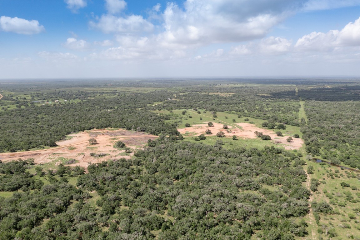 24.68-acres Cattle Guard Road Cuero, TX 77954 - Photo 33 of 49 a view of a lake with houses in back