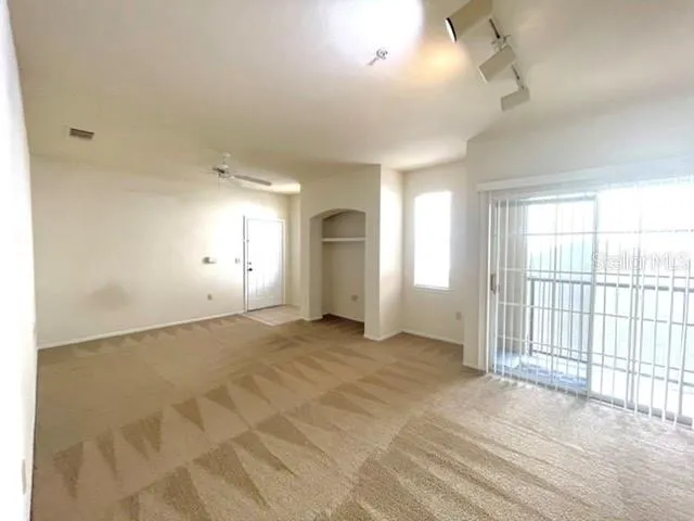 a view of an empty room with a window