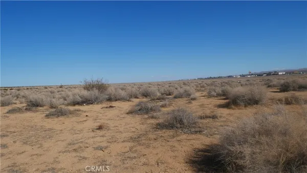 a view of a dry grass field