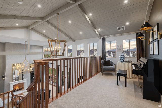 558 West Rheinfalls Circle Midway, UT 84049 - Photo 35 of 61 Vaulted shiplap ceiling with exposed beams, wood spindle railing, recessed lighting, and multiple windows