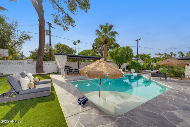 a view of a patio with swimming pool