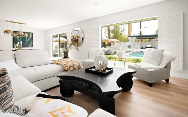 a living room with furniture and a large window