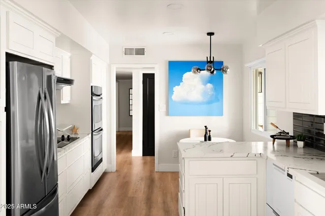 a bathroom with a sink double vanity and a mirror