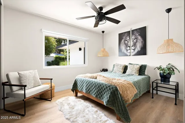 a bedroom with a bed and a couch