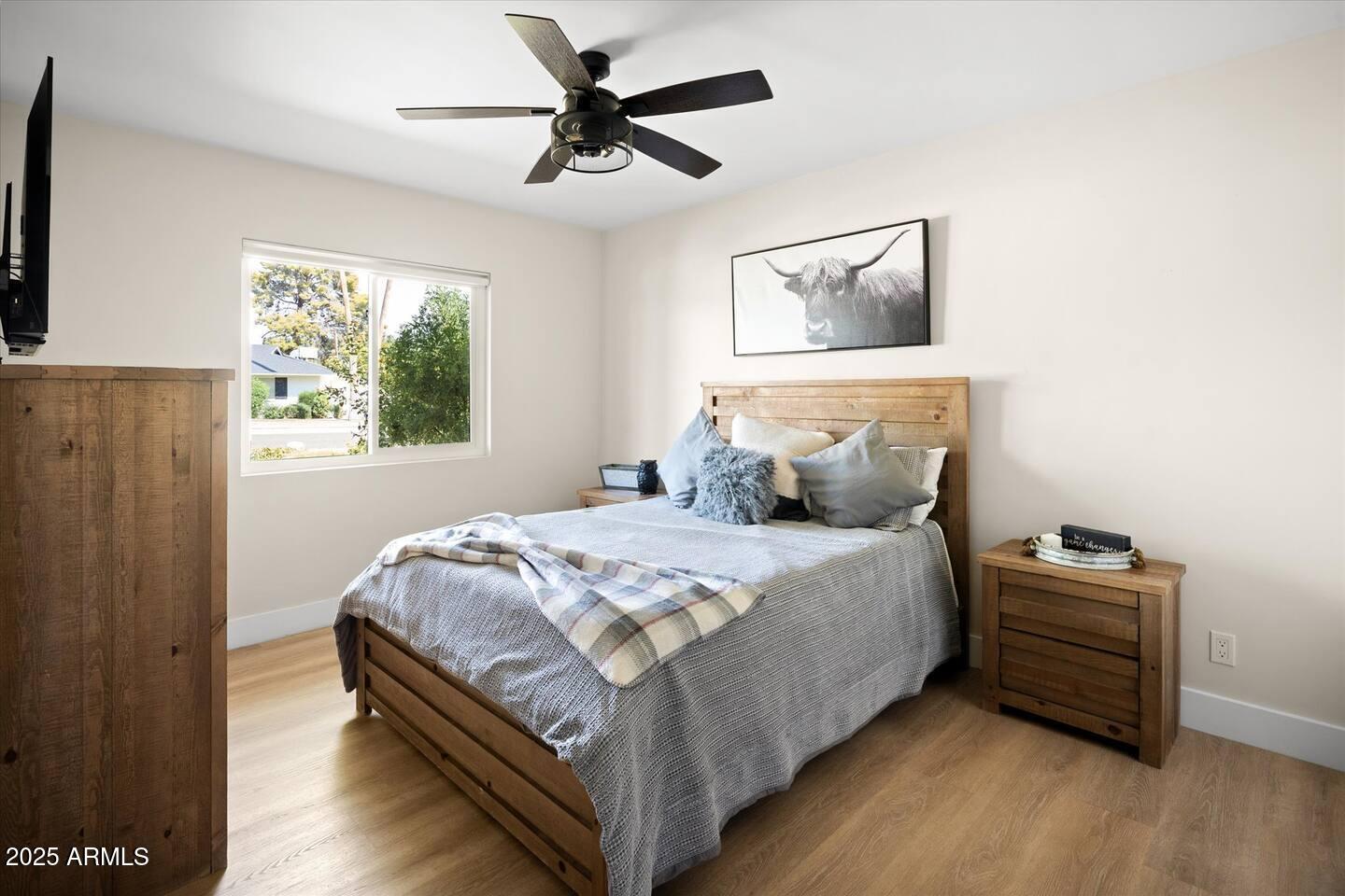 7508 North 13th Avenue Phoenix, AZ 85021 - Photo 28 of 36 a bedroom with a bed and a chandelier